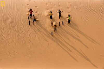 Children play on the sand dune Vietnam fine-art print