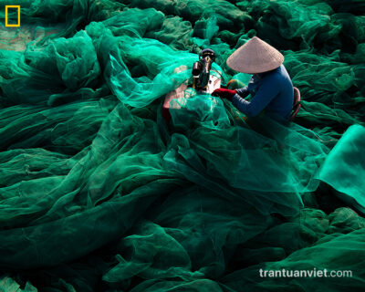 Woman sews net, Ninh Thuan, Vietnam