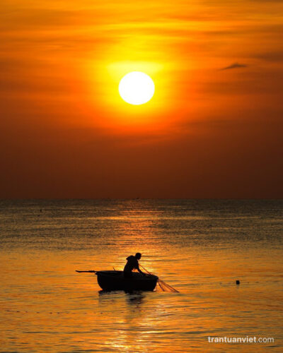 Coracle boat under the sunrise